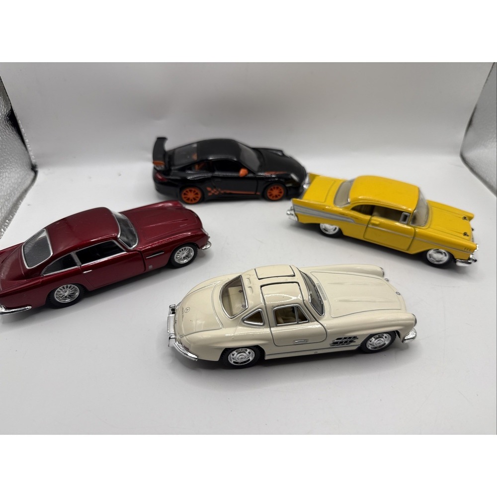 Lot 4 Kinsmart 54 Mercedes 300 SL, 63 Ashton Martin DB5 57 Chevy BelAir 10 Por.